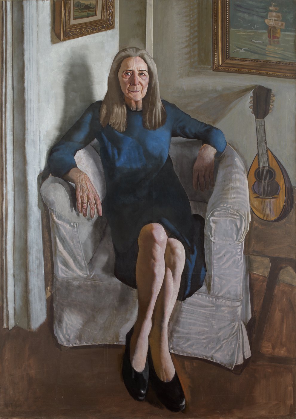 Aris Mertilis, An Old Hour (Μια παλιά ώρα), oil on canvas. Woman in a dark blue dress in a white armchair, a mandolin against the wall.